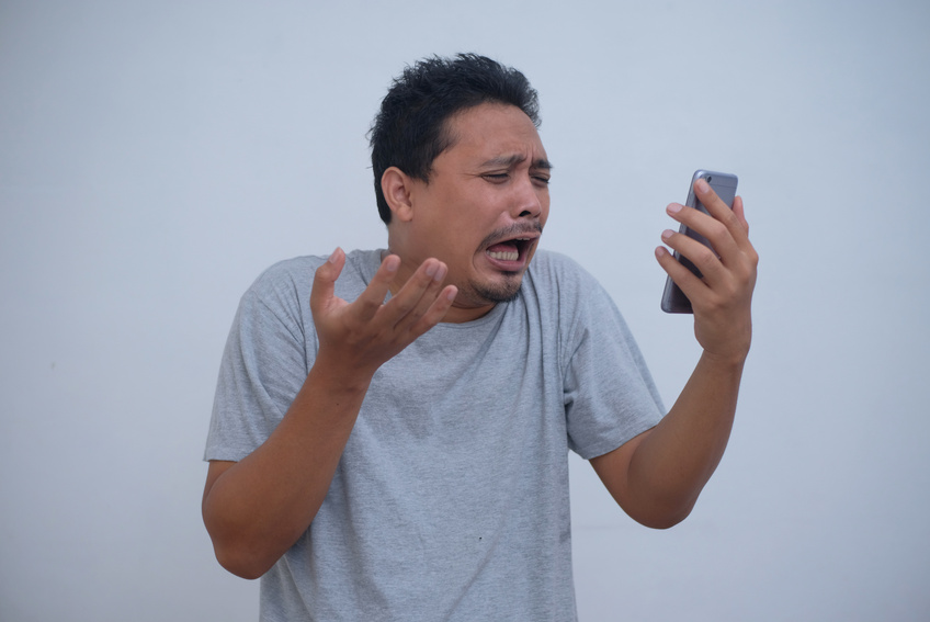 Funny Sad Asian Man Looking Phone